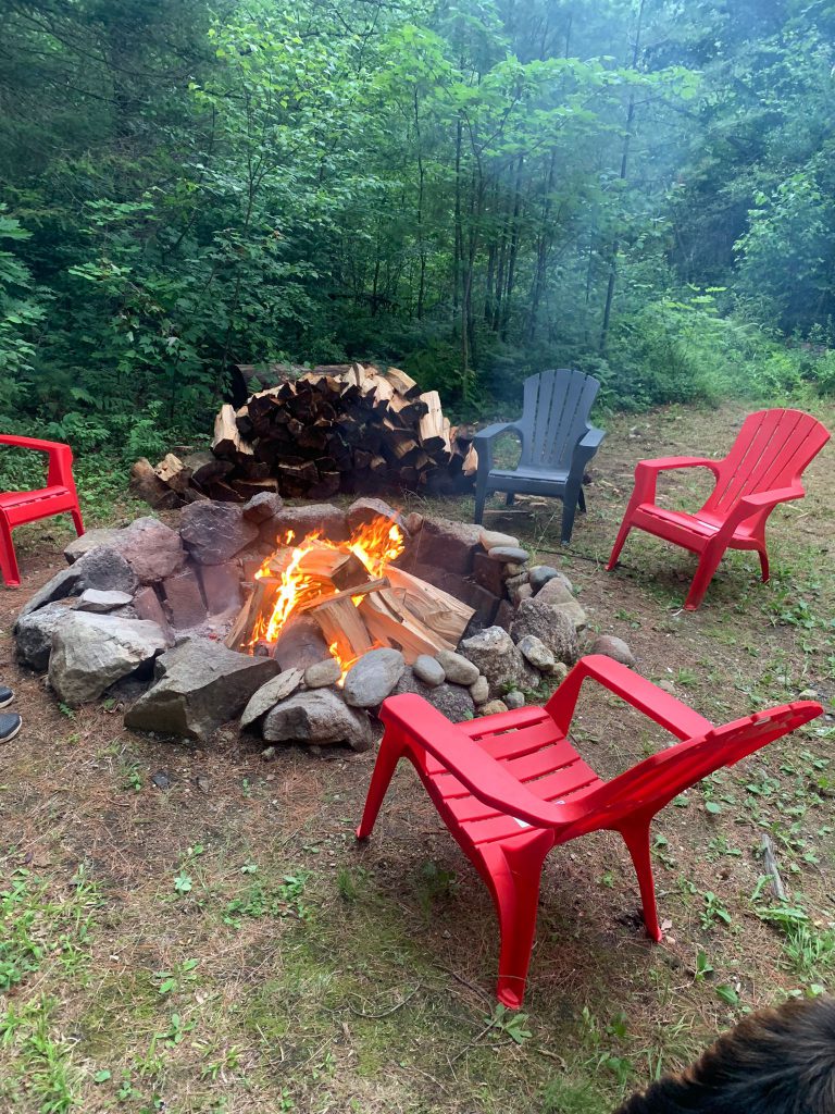 Huge outdoor fireplace is down in the yard for your evening or day chats.