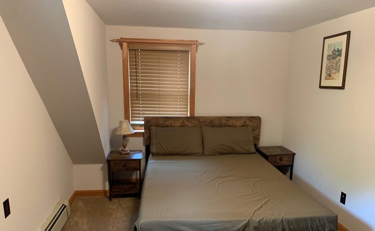 Bedroom number two with a queen sized bed.